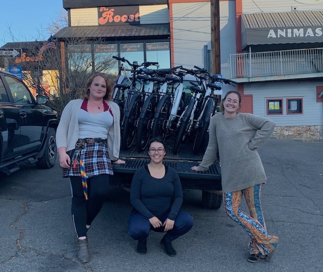 EC students with a truck full of e-bikes.